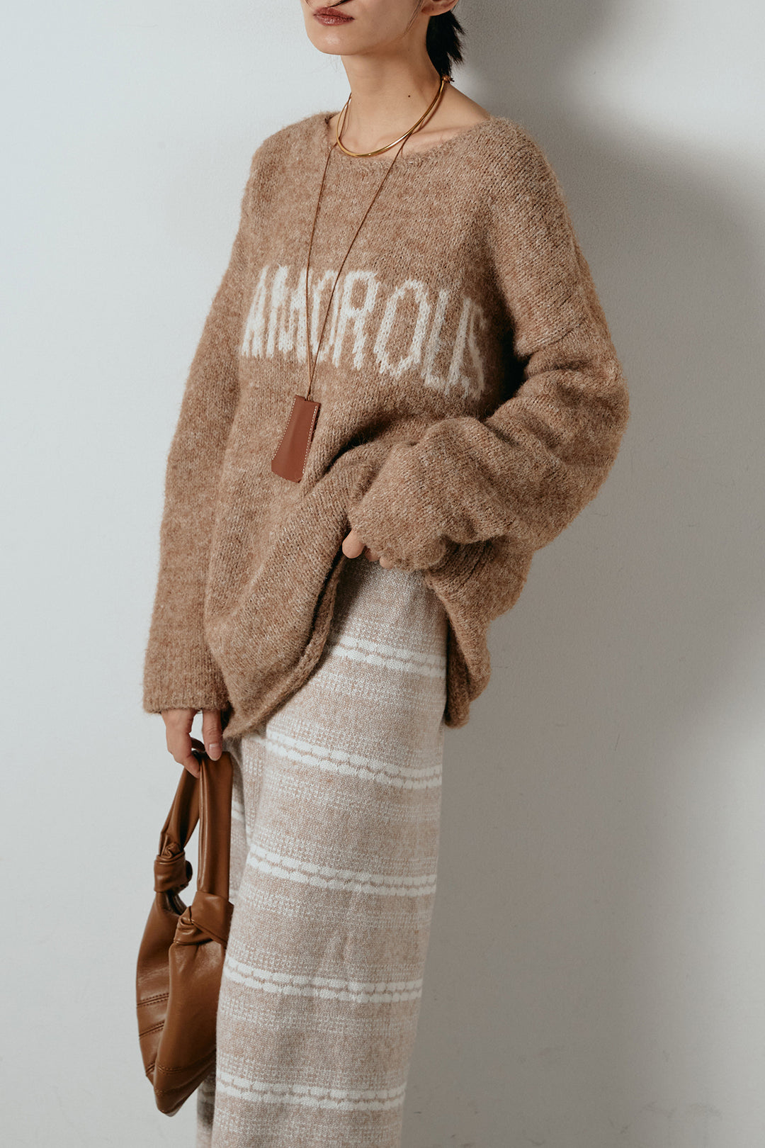 [SET]フロントロゴデザインニットトップス+マルチライン柄リラックスニットパンツ(2set)