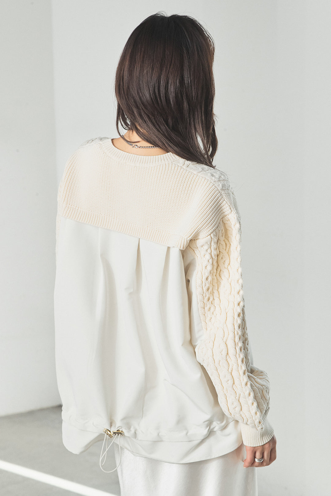 異素材ドッキングケーブルニット