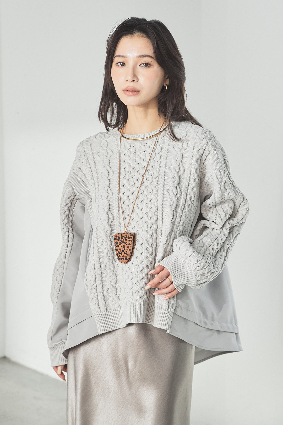 異素材ドッキングケーブルニット