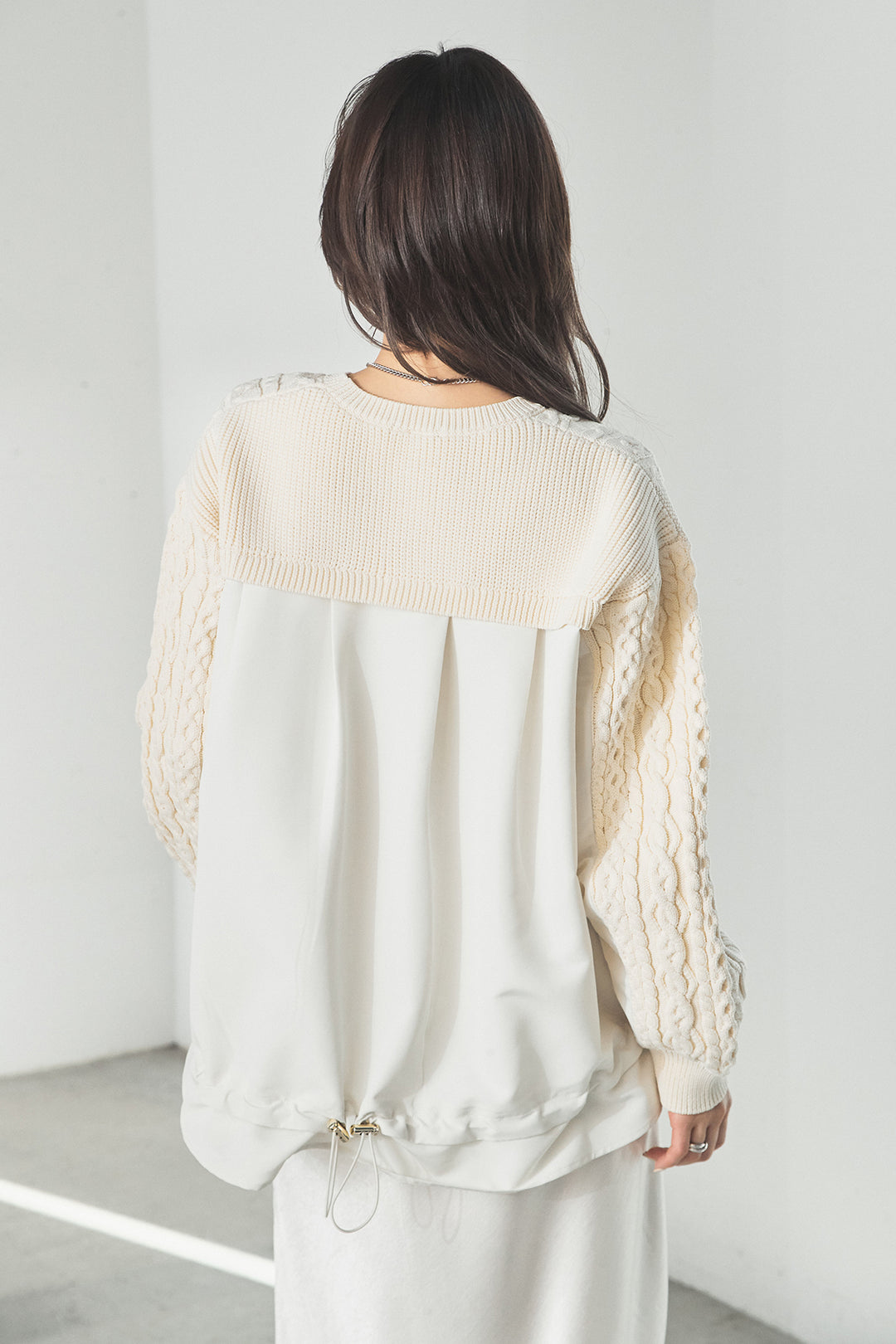 異素材ドッキングケーブルニット