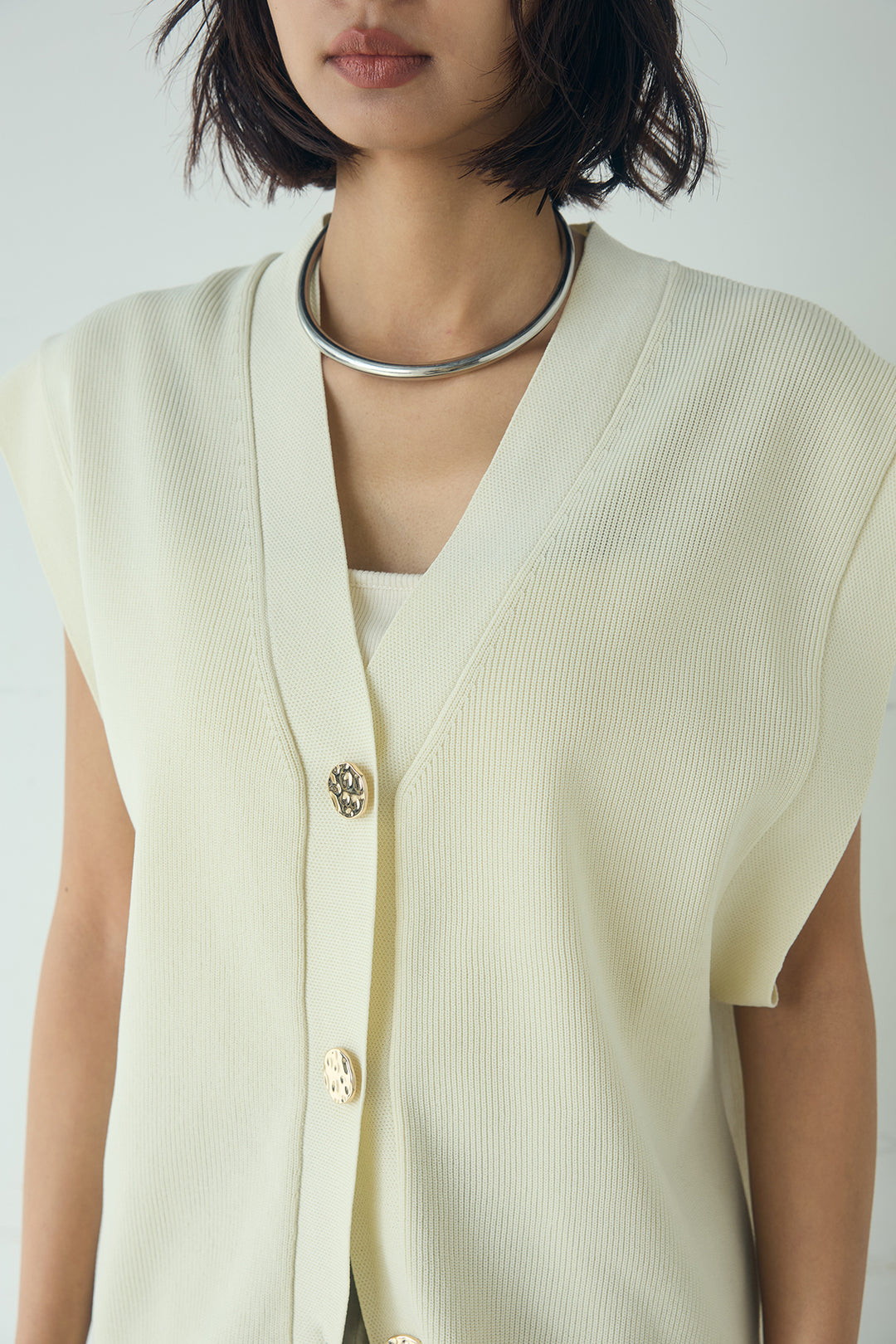 ポリウーリーメタルボタンベスト